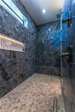 a kitchen with a stove a sink and a refrigerator