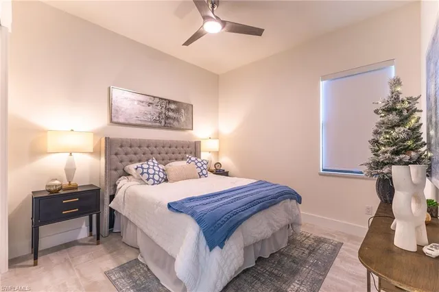 a bedroom with a bed and a night stand