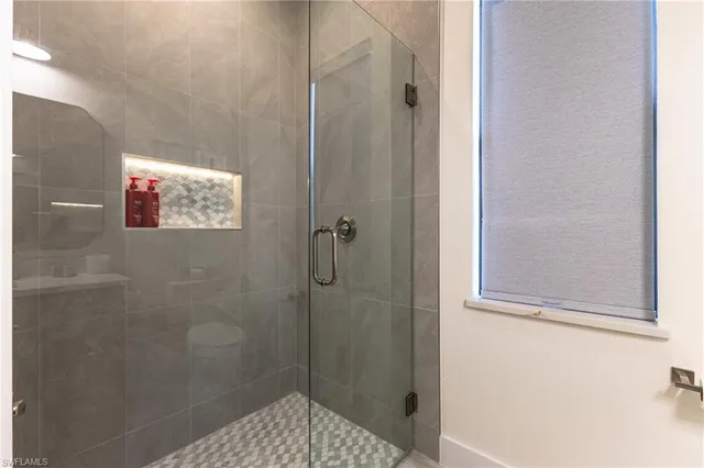 a view of a house with swimming pool and chairs