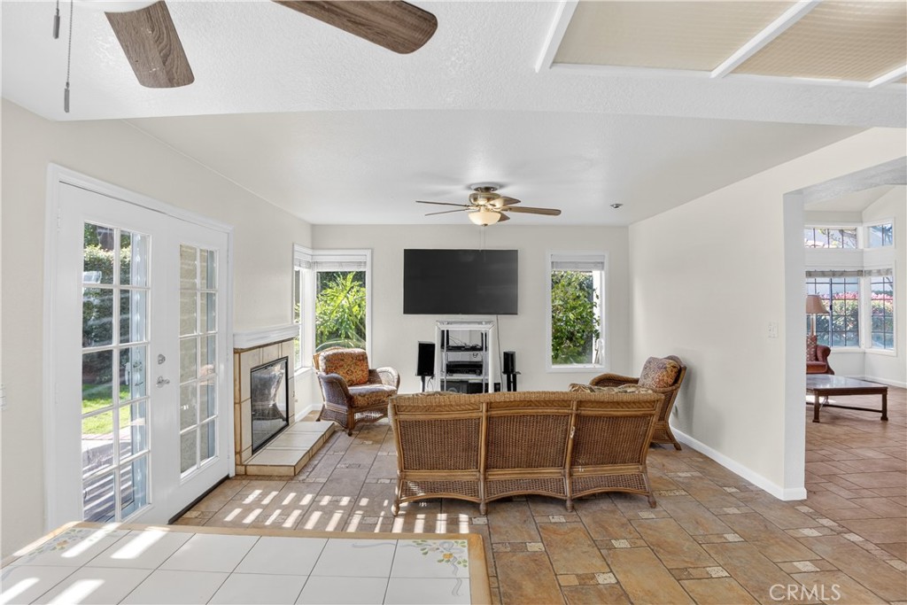 540 Fairfield Road Simi Valley, CA 93065 - Photo 24 of 47 a living room with furniture a flat screen tv and a large window