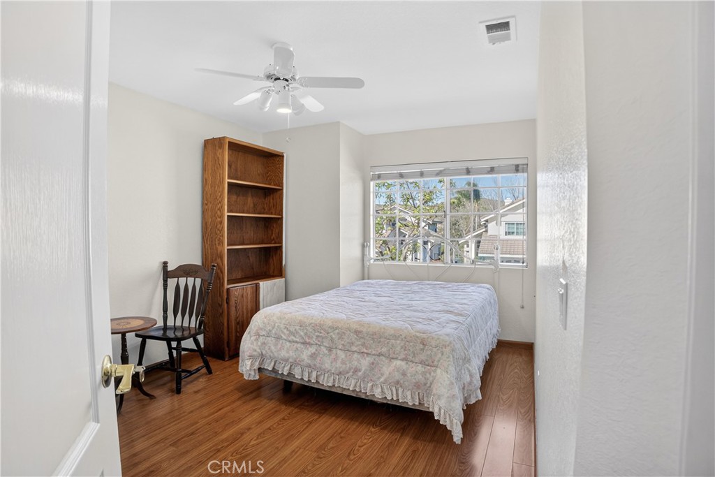 540 Fairfield Road Simi Valley, CA 93065 - Photo 28 of 47 a bedroom with a bed a table and a large window