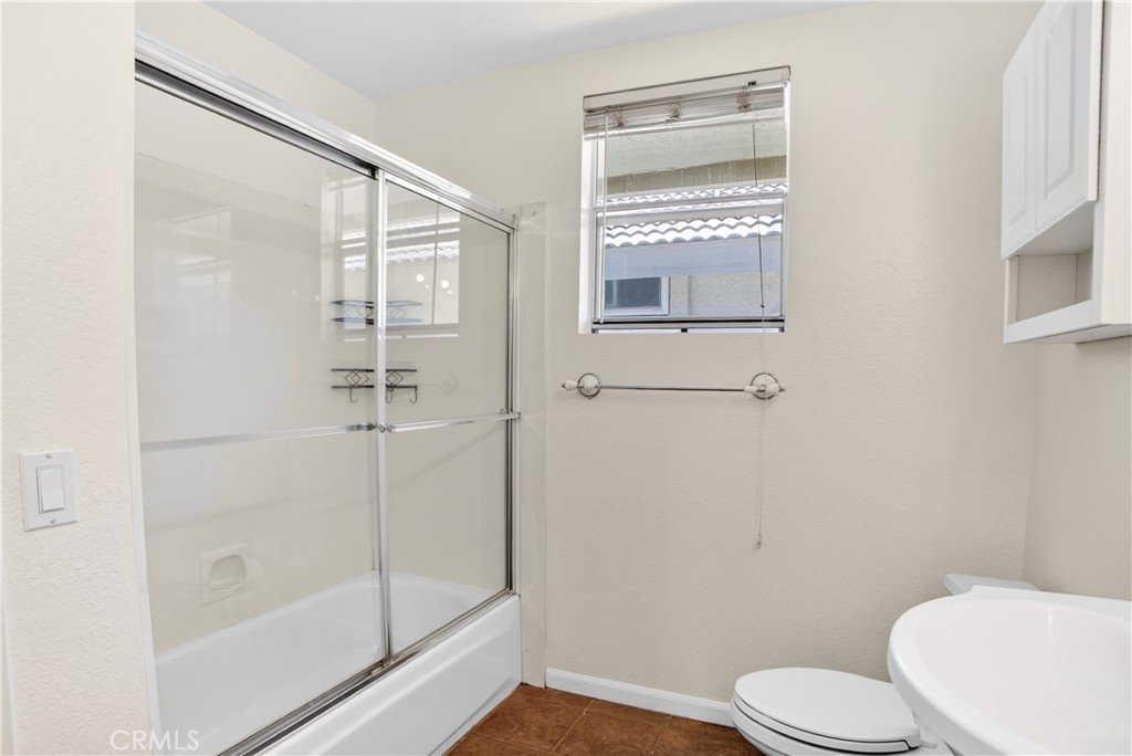 540 Fairfield Road Simi Valley, CA 93065 - Photo 33 of 47 a white toilet sitting next to a bathroom sink