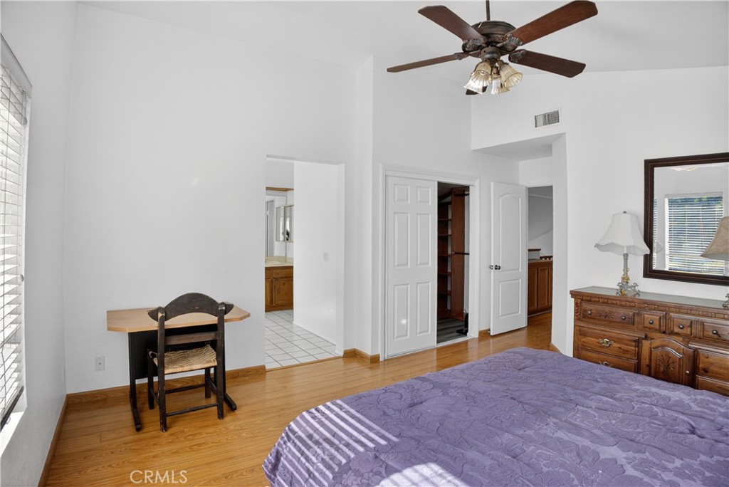 540 Fairfield Road Simi Valley, CA 93065 - Photo 37 of 47 a bedroom with a bed and a chandelier