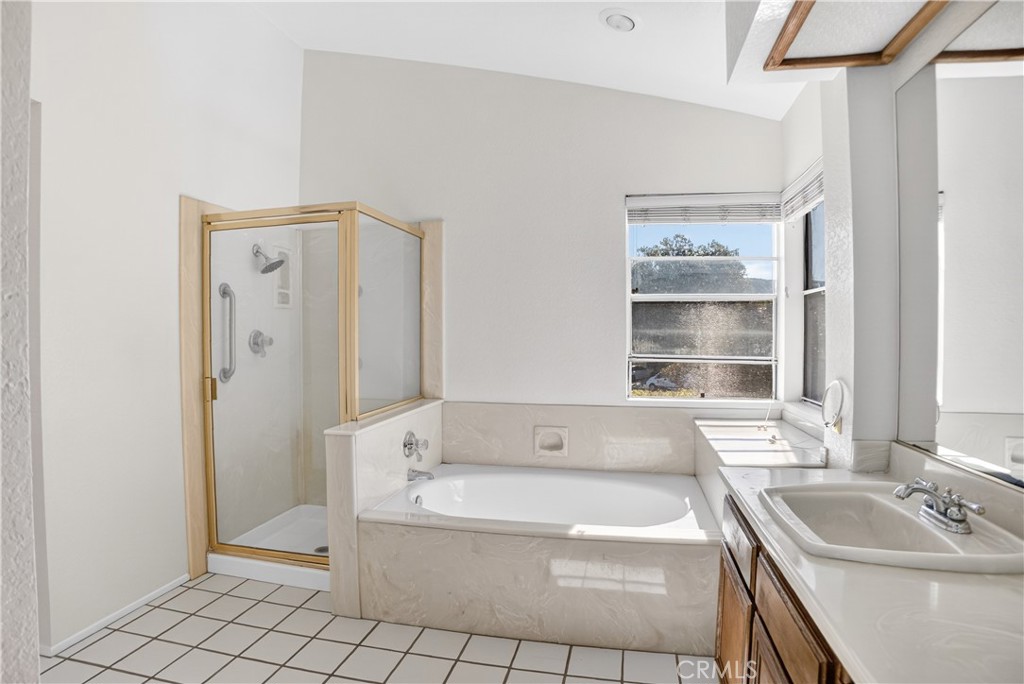 540 Fairfield Road Simi Valley, CA 93065 - Photo 39 of 47 a bathroom with a tub sink and window