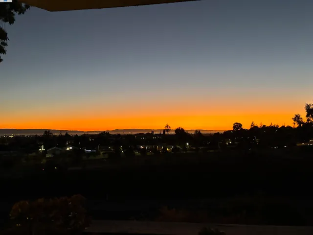 a view of a car parked front of a house