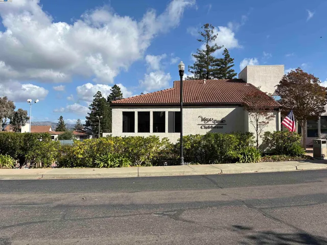 a view of a backyard with sitting area