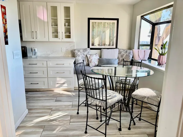 a view of a dining room with furniture and window