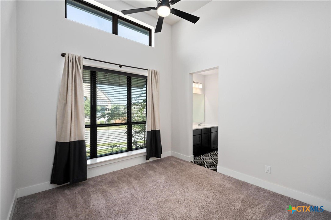 412 Pin Cherry Pass San Marcos, TX 78666 - Photo 16 of 27 an empty room with windows and closet