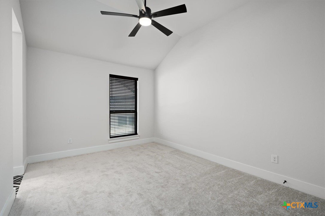 412 Pin Cherry Pass San Marcos, TX 78666 - Photo 17 of 27 a view of an empty room with a window