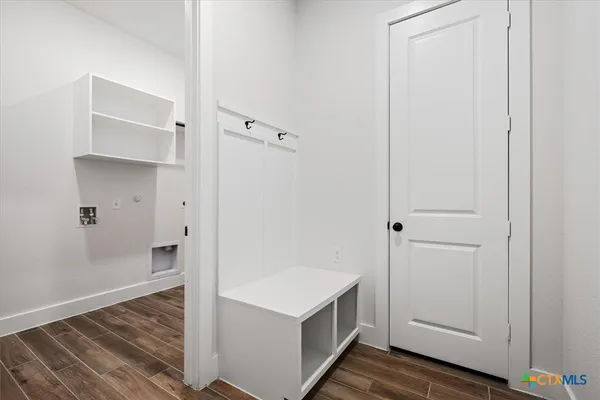 a view of kitchen and wooden floor