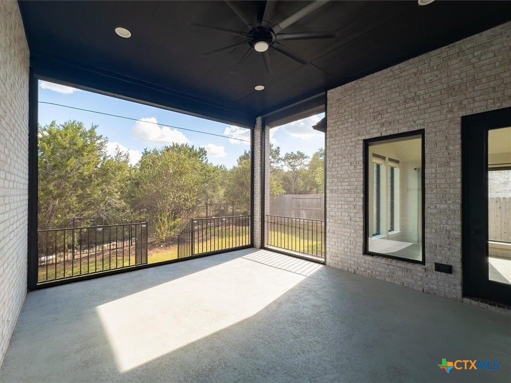 412 Pin Cherry Pass San Marcos, TX 78666 - Photo 22 of 27 a view of an empty room with a balcony