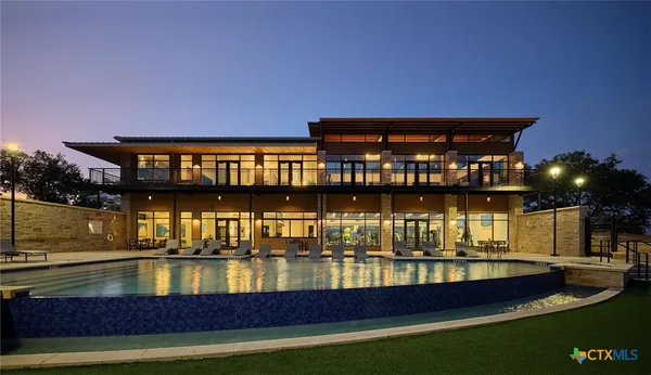 a view of a house with swimming pool