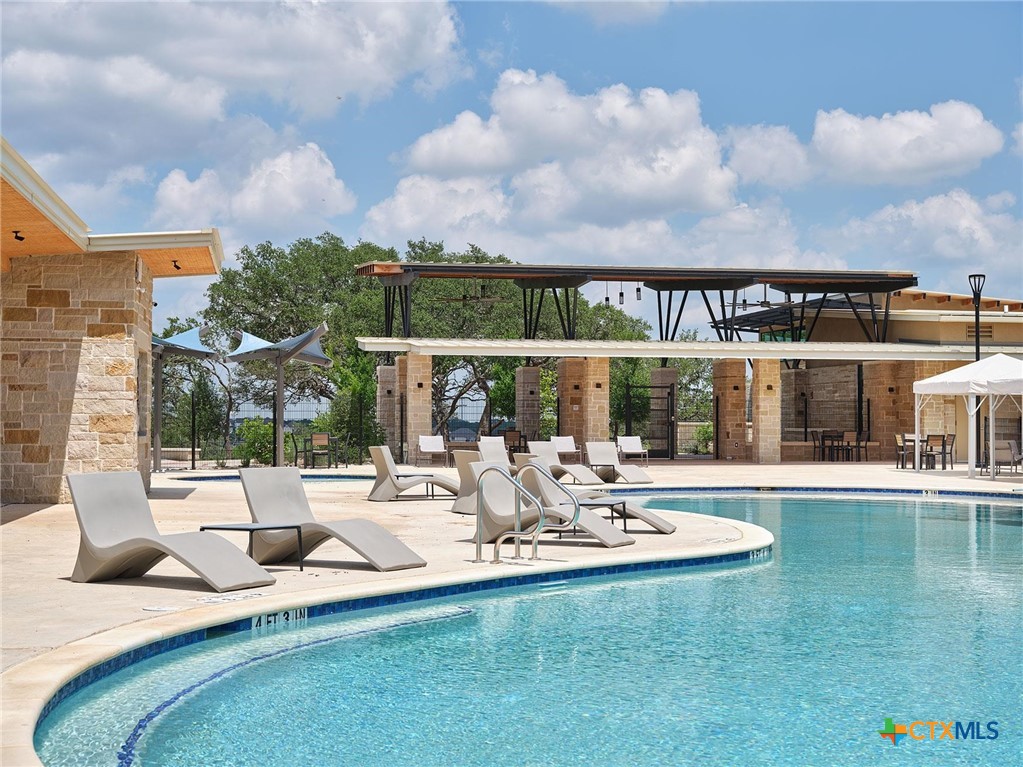 412 Pin Cherry Pass San Marcos, TX 78666 - Photo 27 of 27 a view of pool with outdoor seating