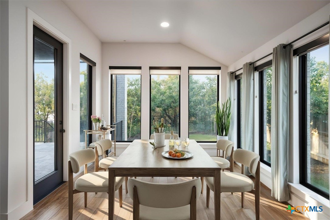 412 Pin Cherry Pass San Marcos, TX 78666 - Photo 8 of 27 a view of a dining room with furniture window and outside view