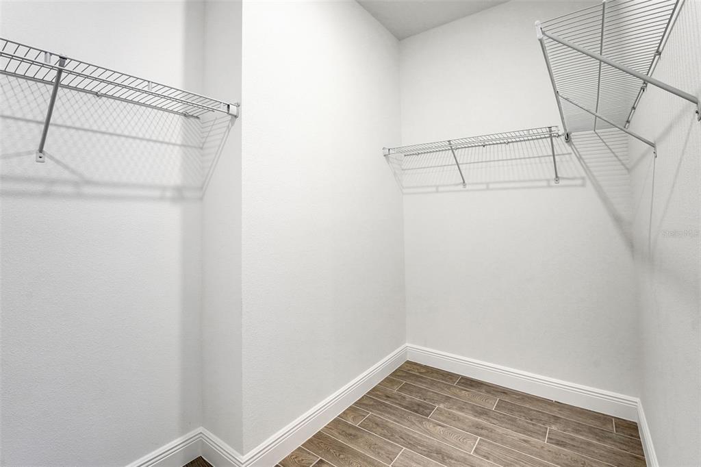 987 Fiesta Key Circle Lady Lake, FL 32159 - Photo 14 of 39 a view of a room with racks on the wall