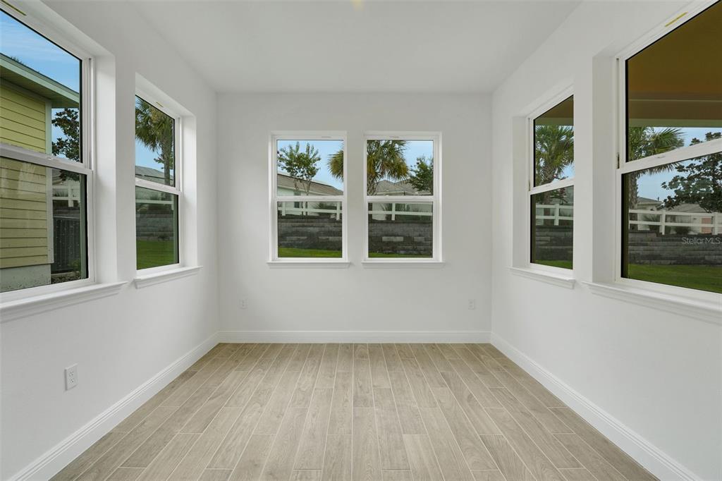 987 Fiesta Key Circle Lady Lake, FL 32159 - Photo 20 of 39 a view of empty room with windows