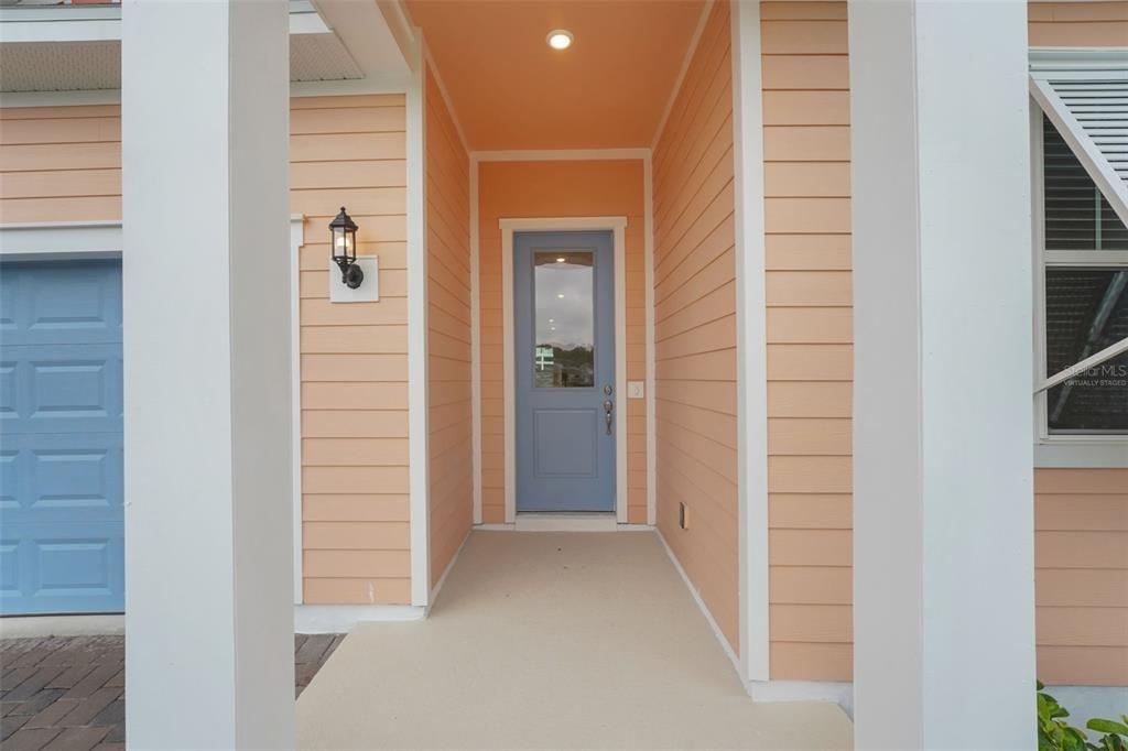 987 Fiesta Key Circle Lady Lake, FL 32159 - Photo 2 of 39 a view of a hallway with wooden shelves