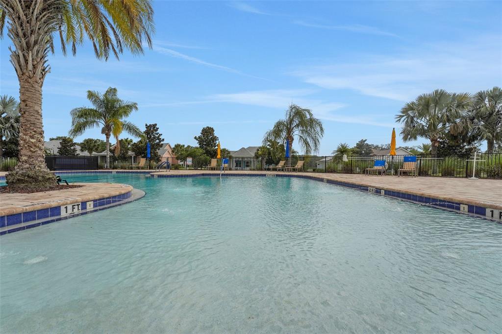 987 Fiesta Key Circle Lady Lake, FL 32159 - Photo 24 of 39 a view of a lake with houses