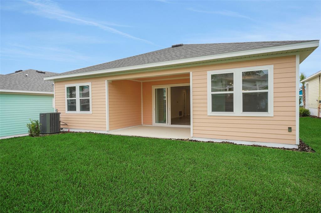 987 Fiesta Key Circle Lady Lake, FL 32159 - Photo 7 of 39 a view of a house with a backyard