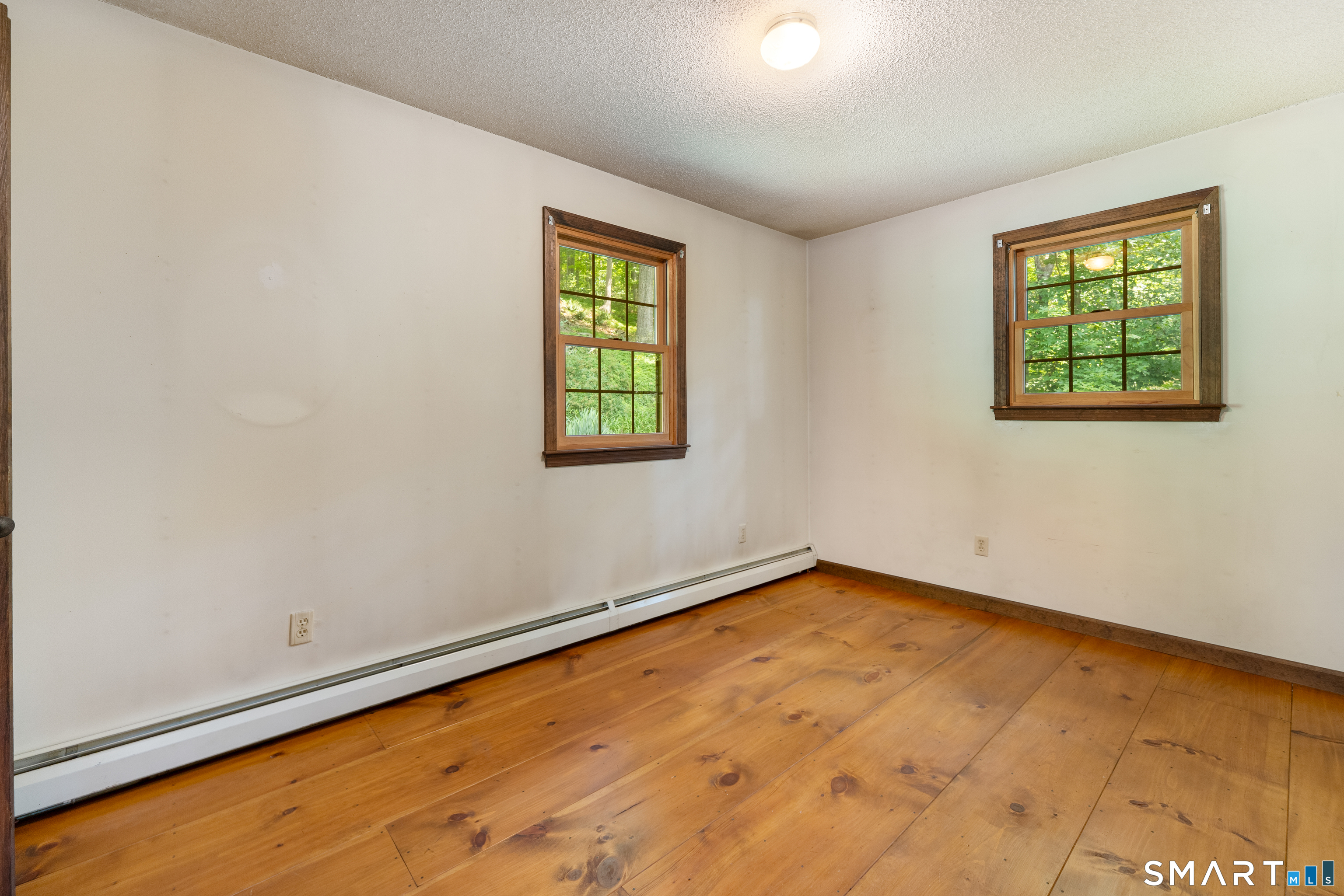35 Pigeon Swamp Road, Unit 2 Lebanon, CT 06249 - Photo 23 of 35 an empty room with windows