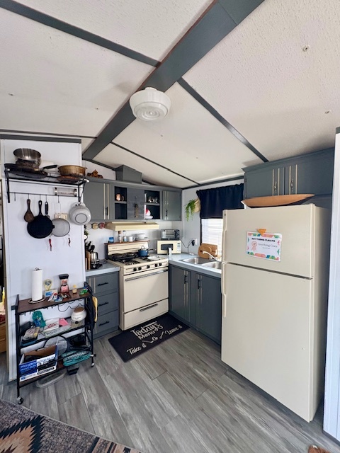 27-34 Woodhaven Sublette, IL 61367 - Photo 11 of 17 a kitchen with refrigerator and stove