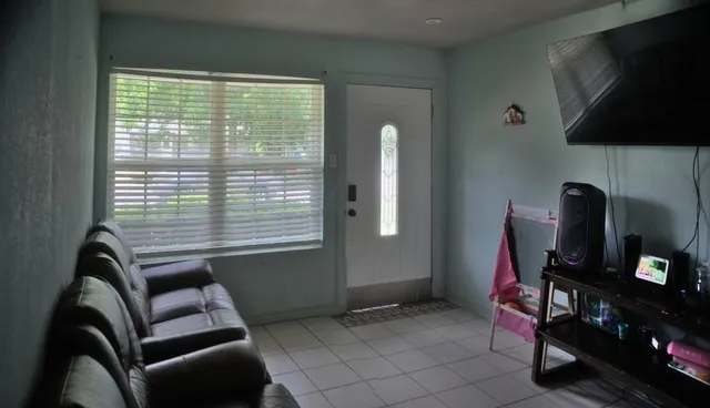 a bedroom with a bed and a lamp