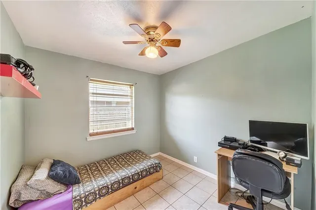 a workspace with a couch and a window
