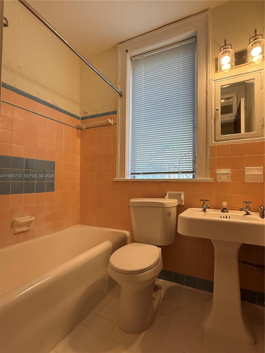 1361 Meridian Avenue, Unit 4 Miami Beach, FL 33139 - Photo 11 of 14 a bathroom with a sink toilet and shower
