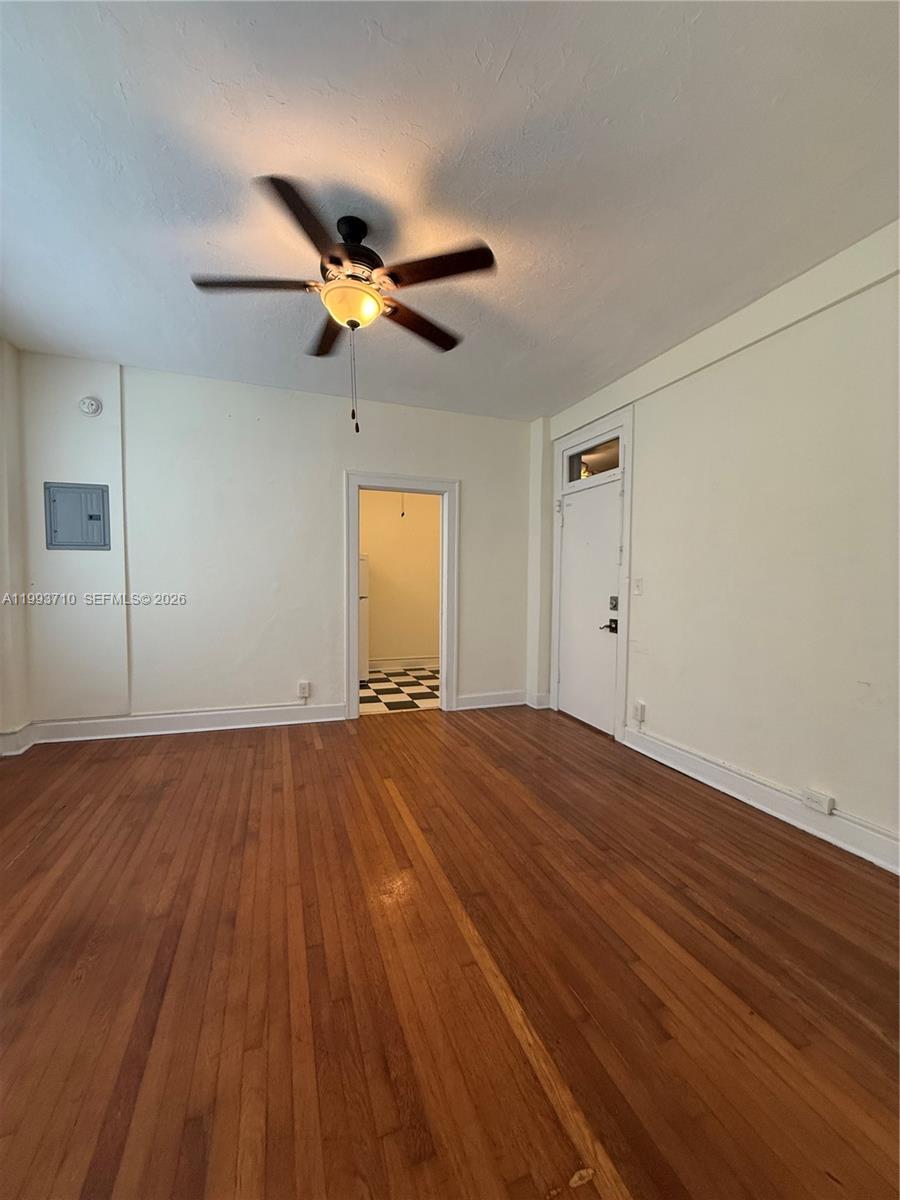 1361 Meridian Avenue, Unit 4 Miami Beach, FL 33139 - Photo 12 of 14 a view of empty room with wooden floor