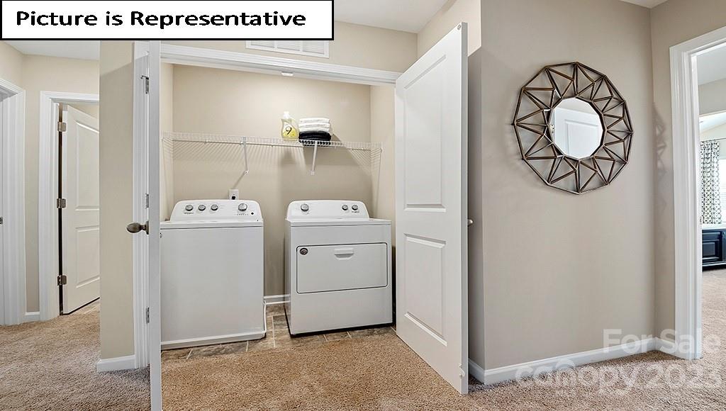 7113 North Mill Road Charlotte, NC 28216 - Photo 14 of 26 a utility room with dryer and washer