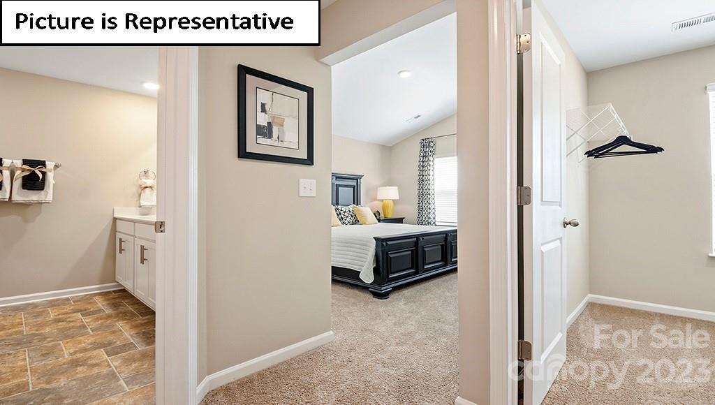 7113 North Mill Road Charlotte, NC 28216 - Photo 15 of 26 a view of a bedroom with bed and window