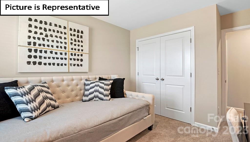 7113 North Mill Road Charlotte, NC 28216 - Photo 24 of 26 a bedroom with a bed and a window