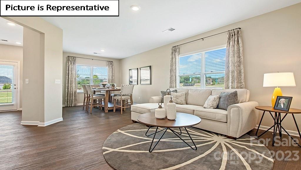 7113 North Mill Road Charlotte, NC 28216 - Photo 4 of 26 a living room with furniture and a table