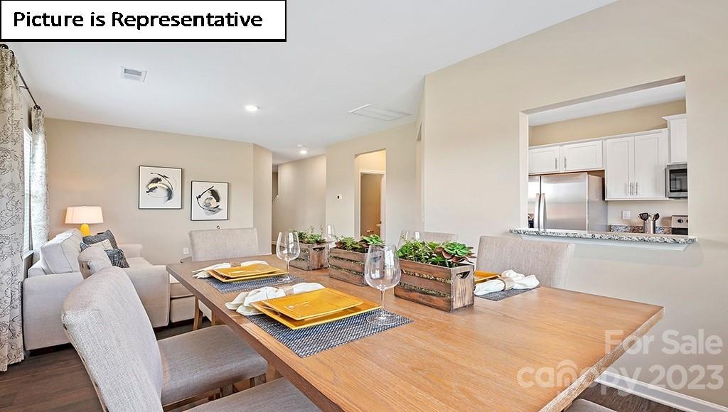 7113 North Mill Road Charlotte, NC 28216 - Photo 8 of 26 a living room with furniture and wooden floor