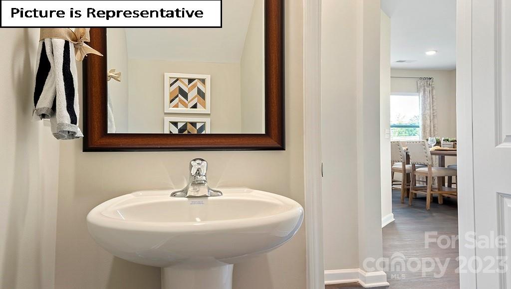 7113 North Mill Road Charlotte, NC 28216 - Photo 10 of 26 a bathroom with a sink and a mirror