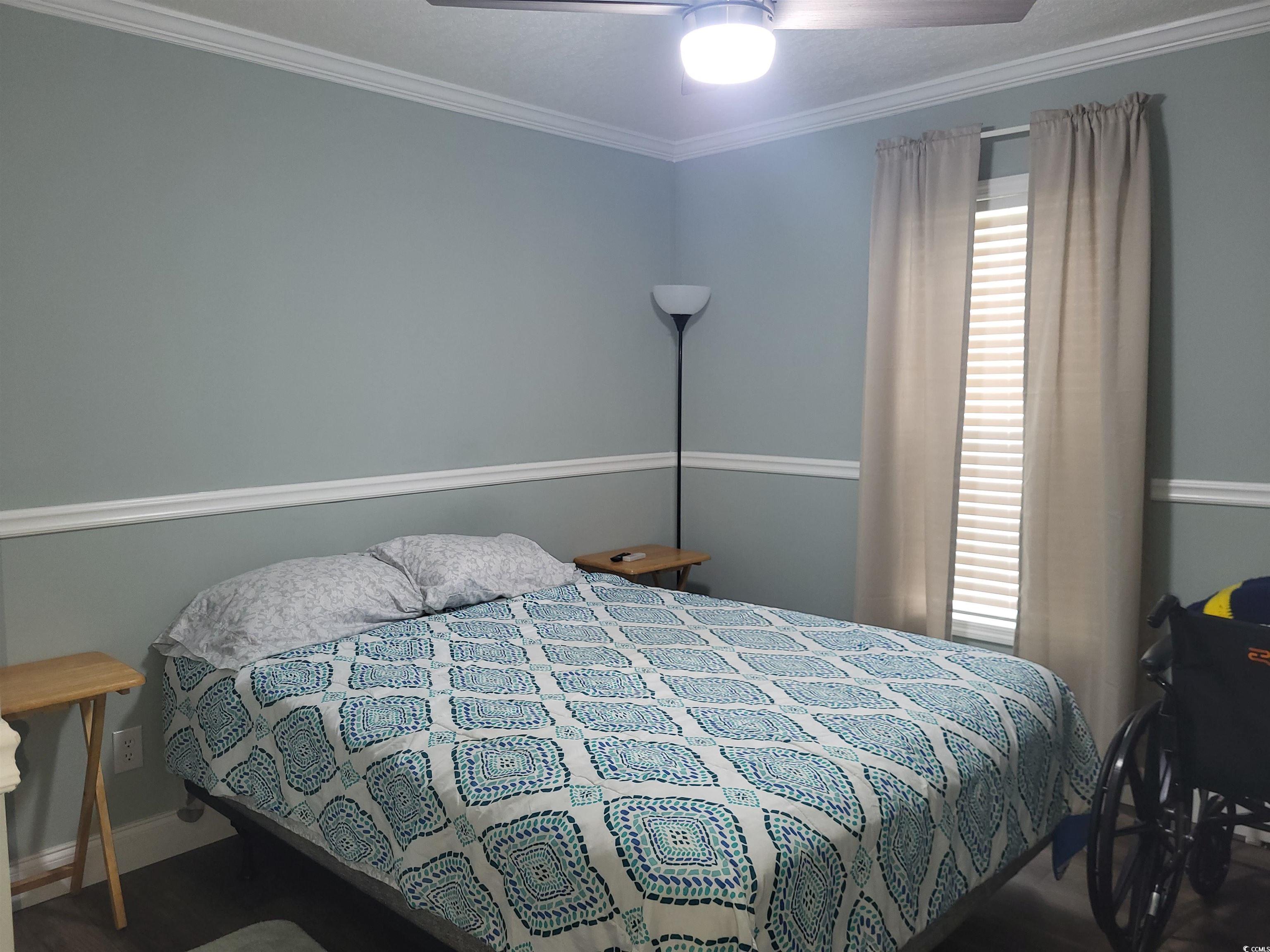 181 Offshore Drive Murrells Inlet, SC 29576 - Photo 16 of 28 Bedroom featuring ornamental molding and a ceiling fan