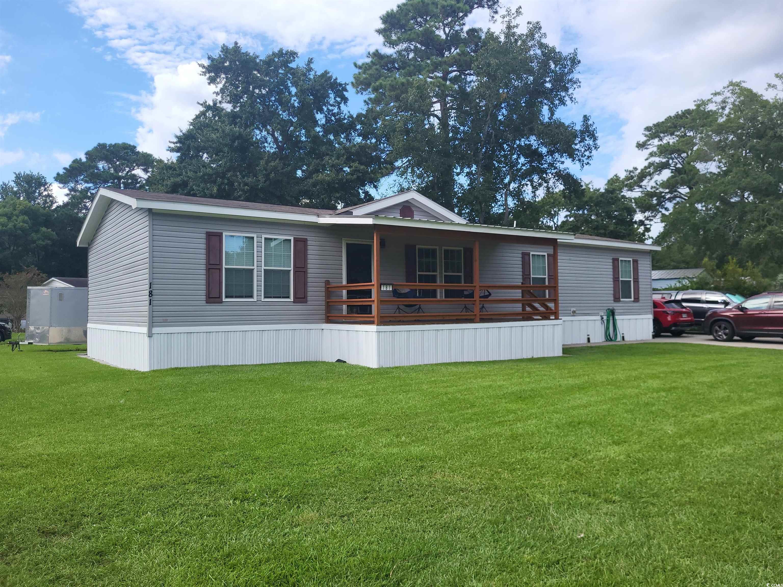 181 Offshore Drive Murrells Inlet, SC 29576 - Photo 2 of 28 View of front of house with a front lawn and a porch