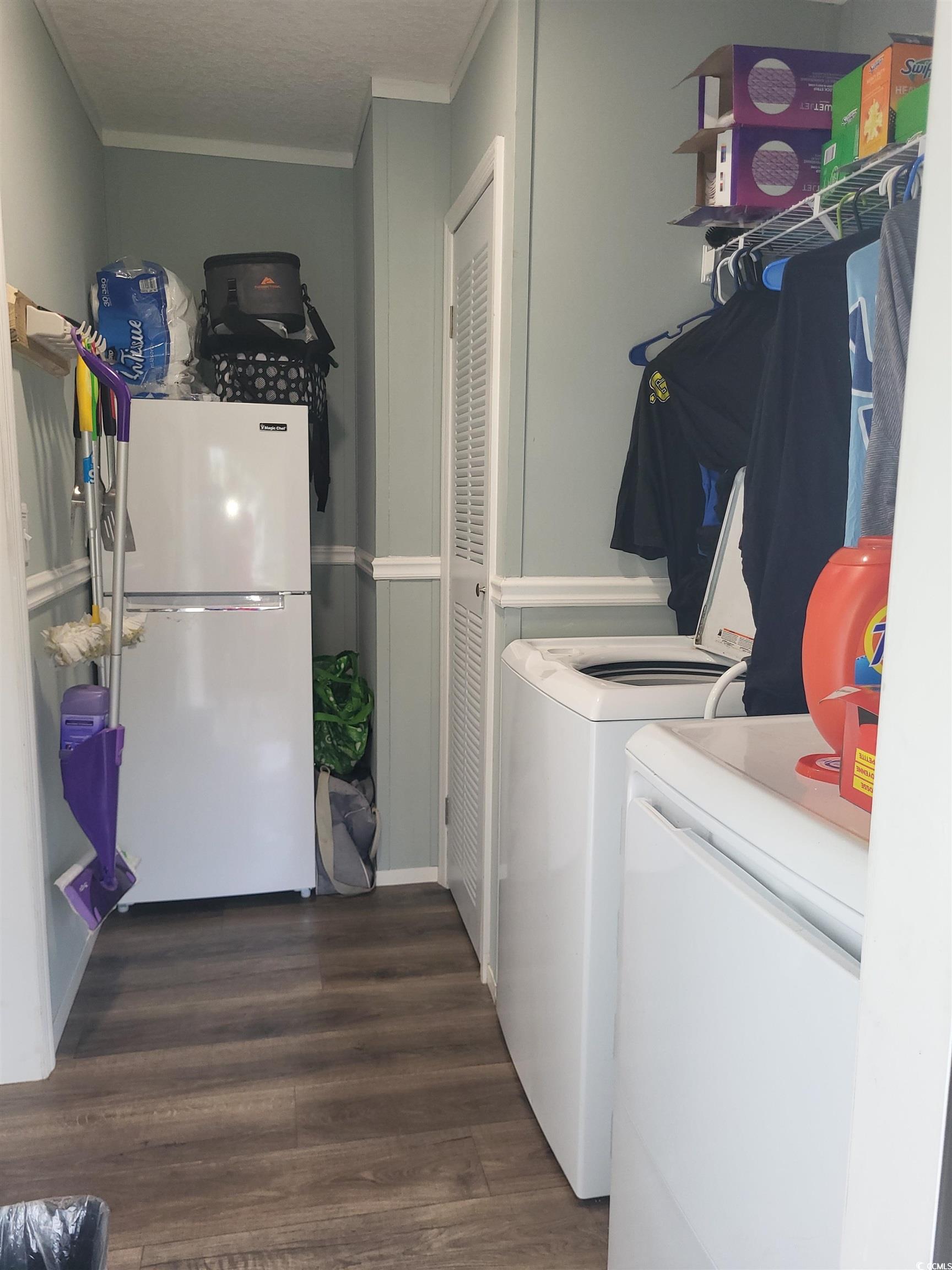 181 Offshore Drive Murrells Inlet, SC 29576 - Photo 20 of 28 Laundry area with dark wood-style floors, crown molding, and separate washer and dryer