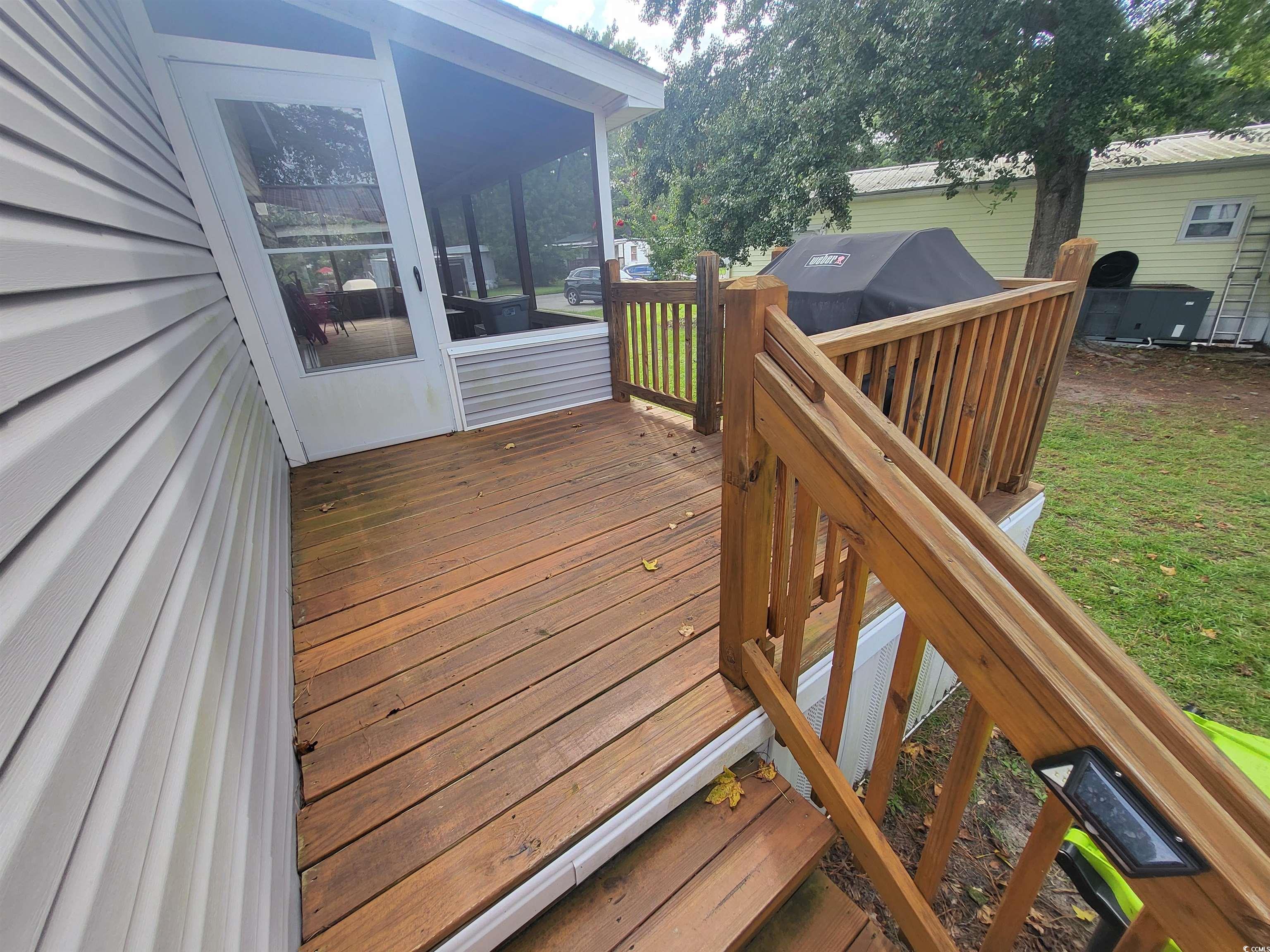 181 Offshore Drive Murrells Inlet, SC 29576 - Photo 22 of 28 Deck with a sunroom