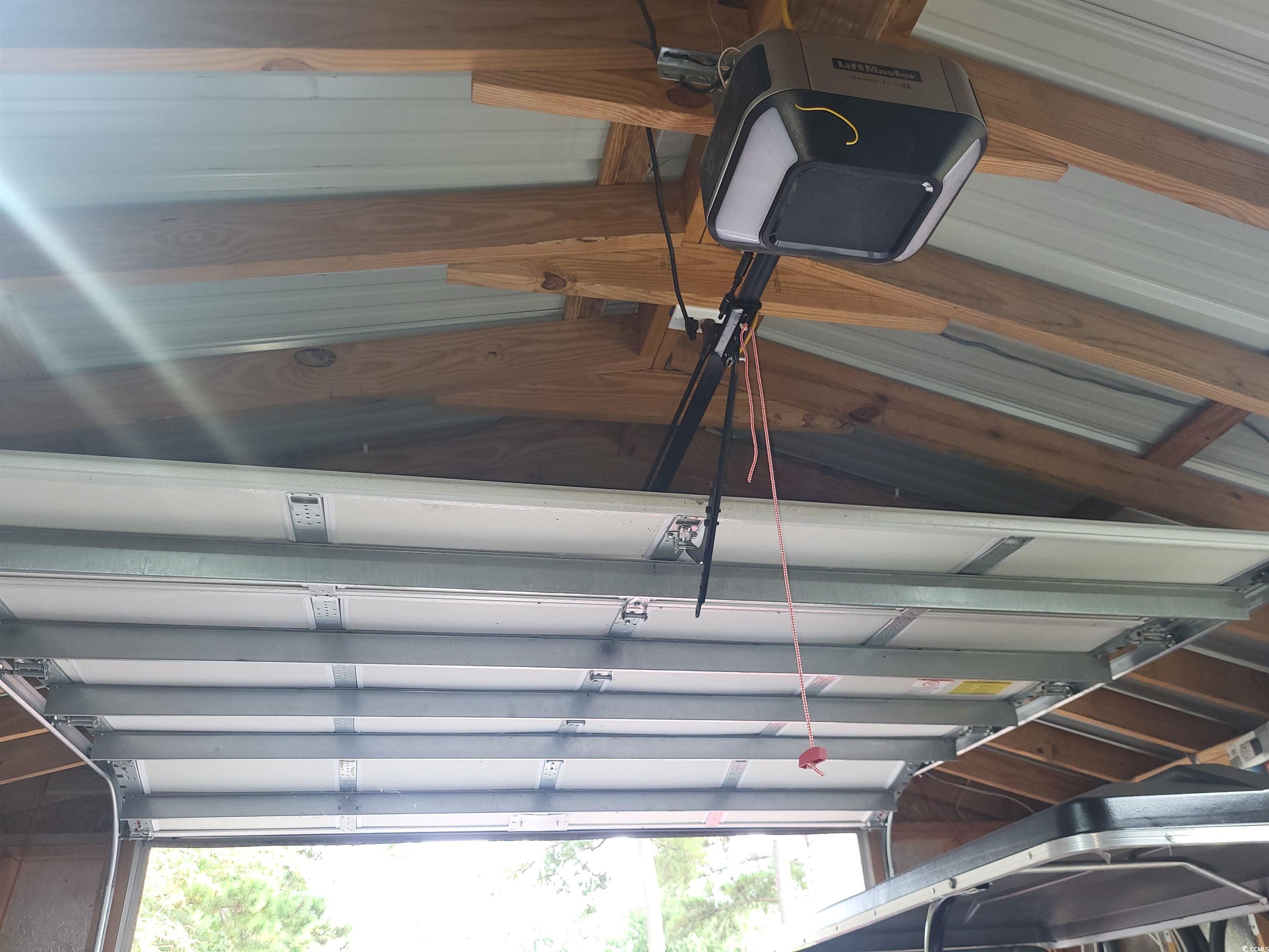 181 Offshore Drive Murrells Inlet, SC 29576 - Photo 26 of 28 Garage with a garage door opener