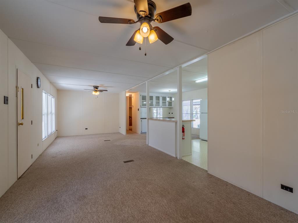 24797 Northeast 135th Street Salt Springs, FL 32134 - Photo 12 of 61 a view of an empty room with a ceiling fan