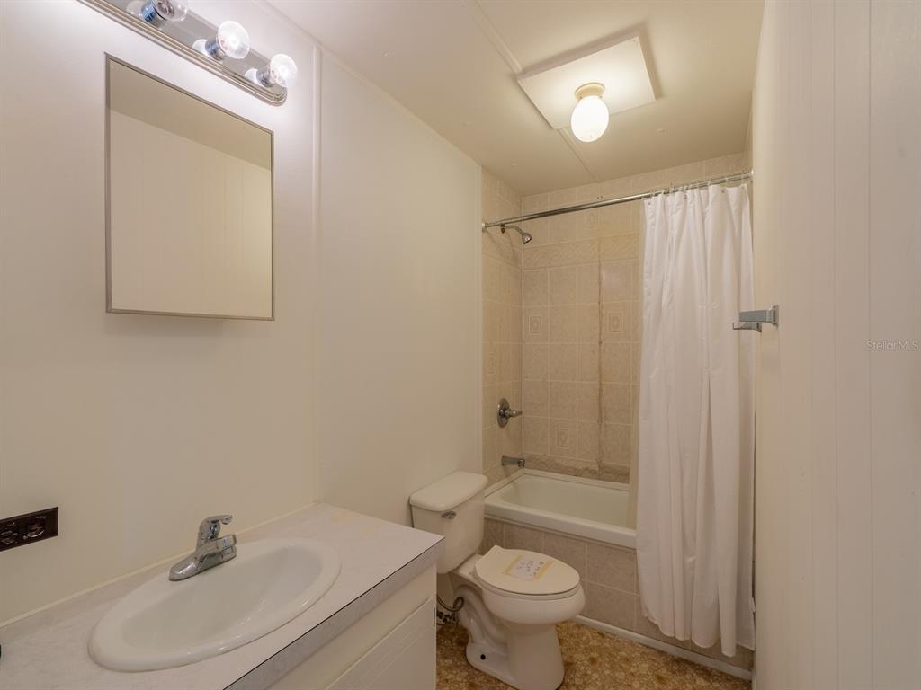 24797 Northeast 135th Street Salt Springs, FL 32134 - Photo 19 of 61 a bathroom with a sink a toilet and shower
