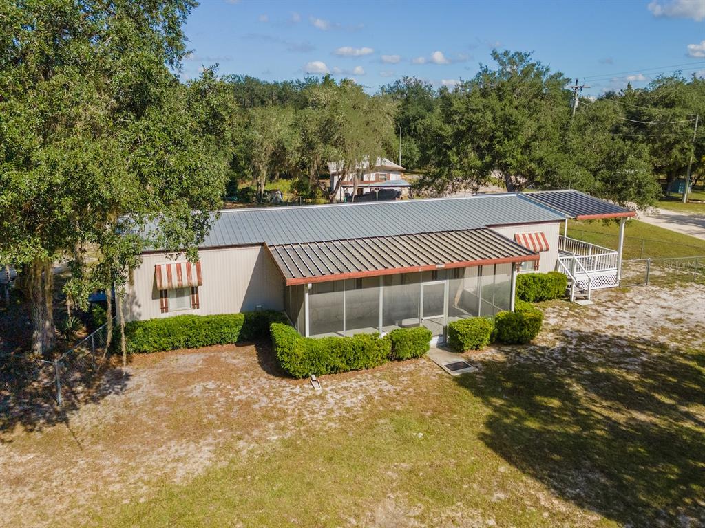 24797 Northeast 135th Street Salt Springs, FL 32134 - Photo 3 of 61 a view of a back yard of the house