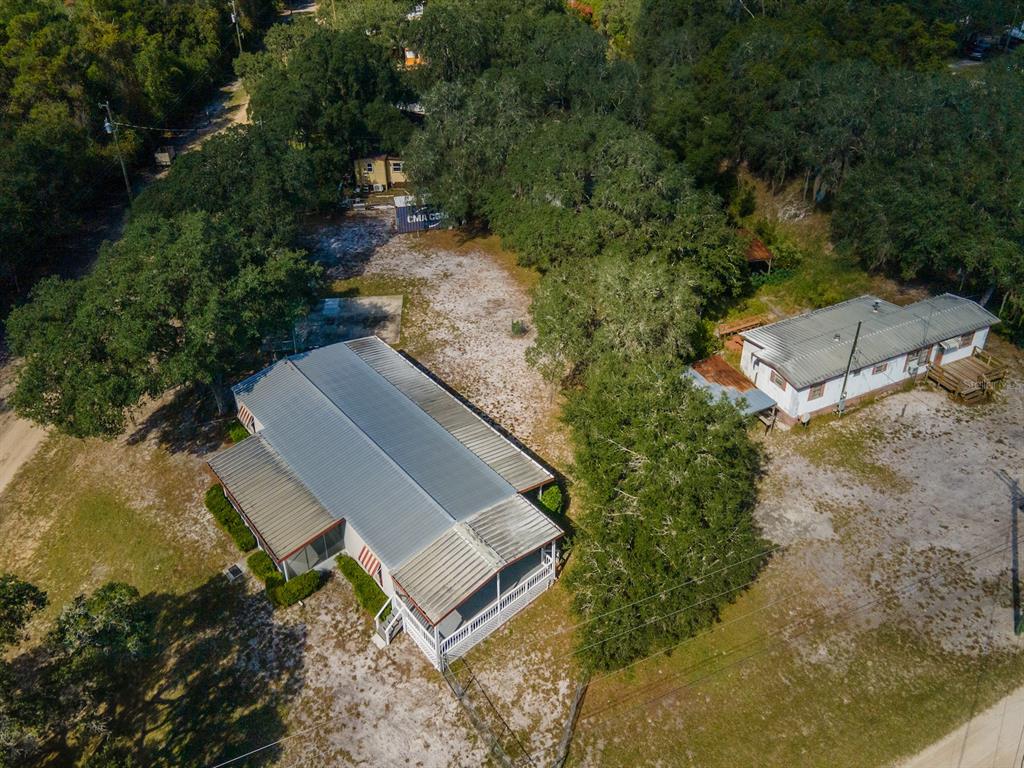 24797 Northeast 135th Street Salt Springs, FL 32134 - Photo 32 of 61 an aerial view of a house with a yard