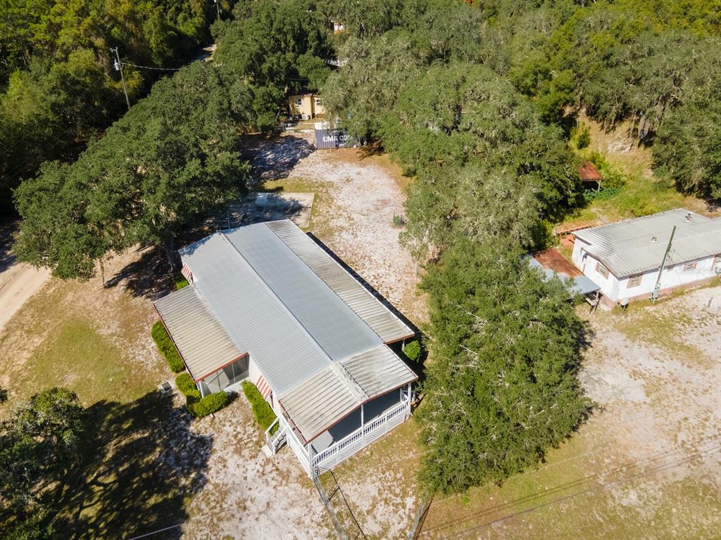 24797 Northeast 135th Street Salt Springs, FL 32134 - Photo 36 of 61 an aerial view of a house with a yard