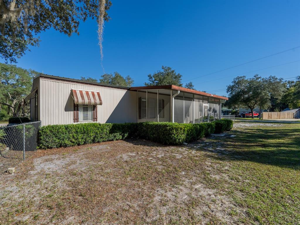 24797 Northeast 135th Street Salt Springs, FL 32134 - Photo 38 of 61 a view of a house with a yard
