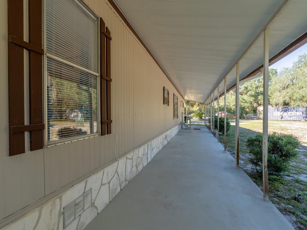 24797 Northeast 135th Street Salt Springs, FL 32134 - Photo 41 of 61 a view of a porch