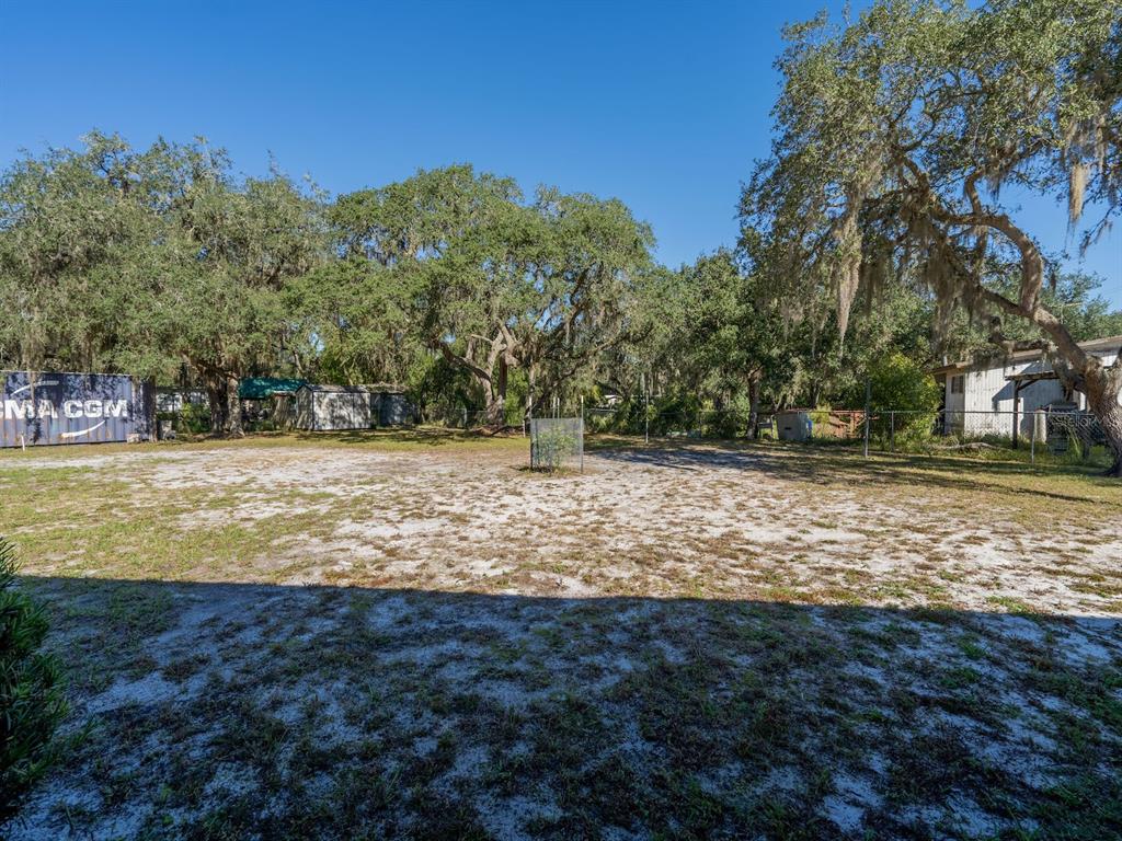 24797 Northeast 135th Street Salt Springs, FL 32134 - Photo 46 of 61 a view of a yard with a house