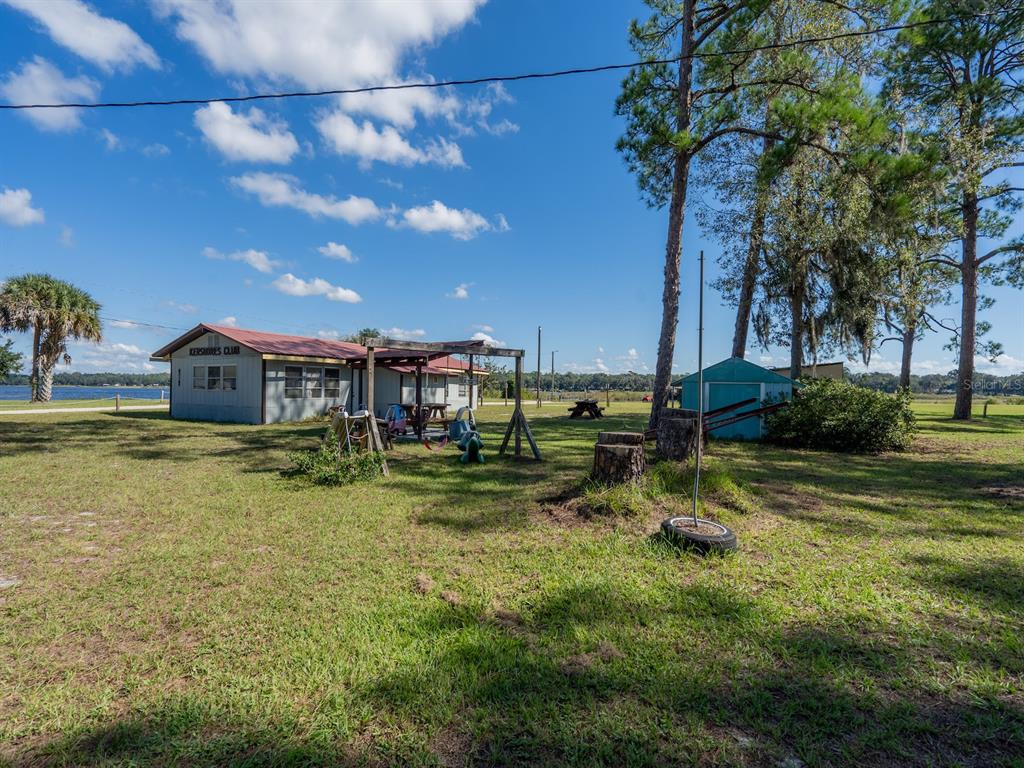 24797 Northeast 135th Street Salt Springs, FL 32134 - Photo 48 of 61 a view of a house with a yard