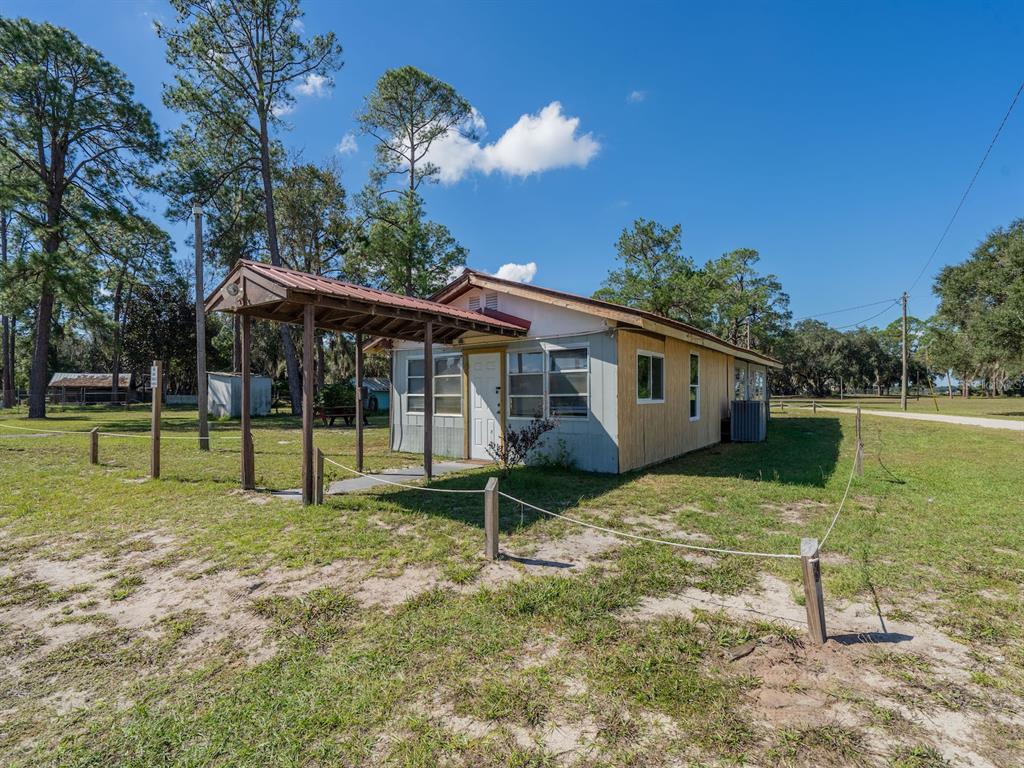 24797 Northeast 135th Street Salt Springs, FL 32134 - Photo 49 of 61 a view of a house with backyard
